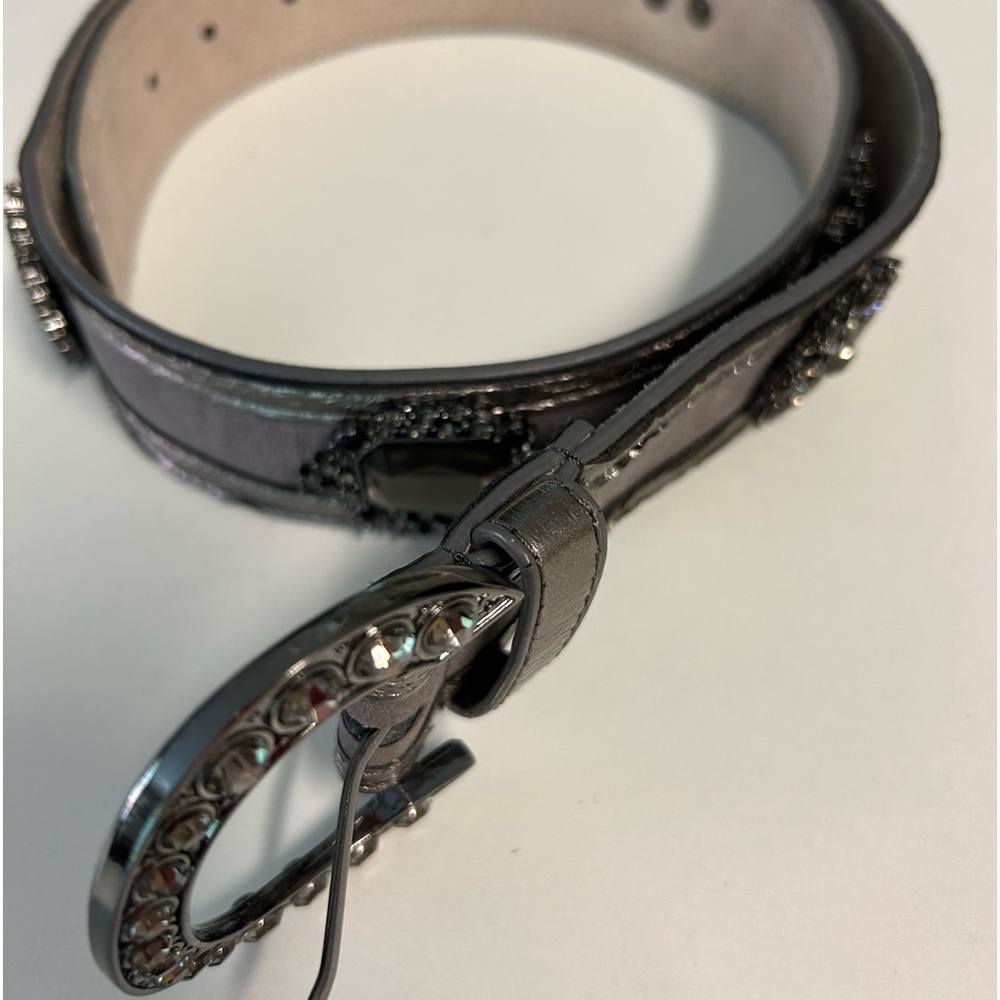 34” from bottom of buckle to first hole. 37” total from btm of buckle to end.